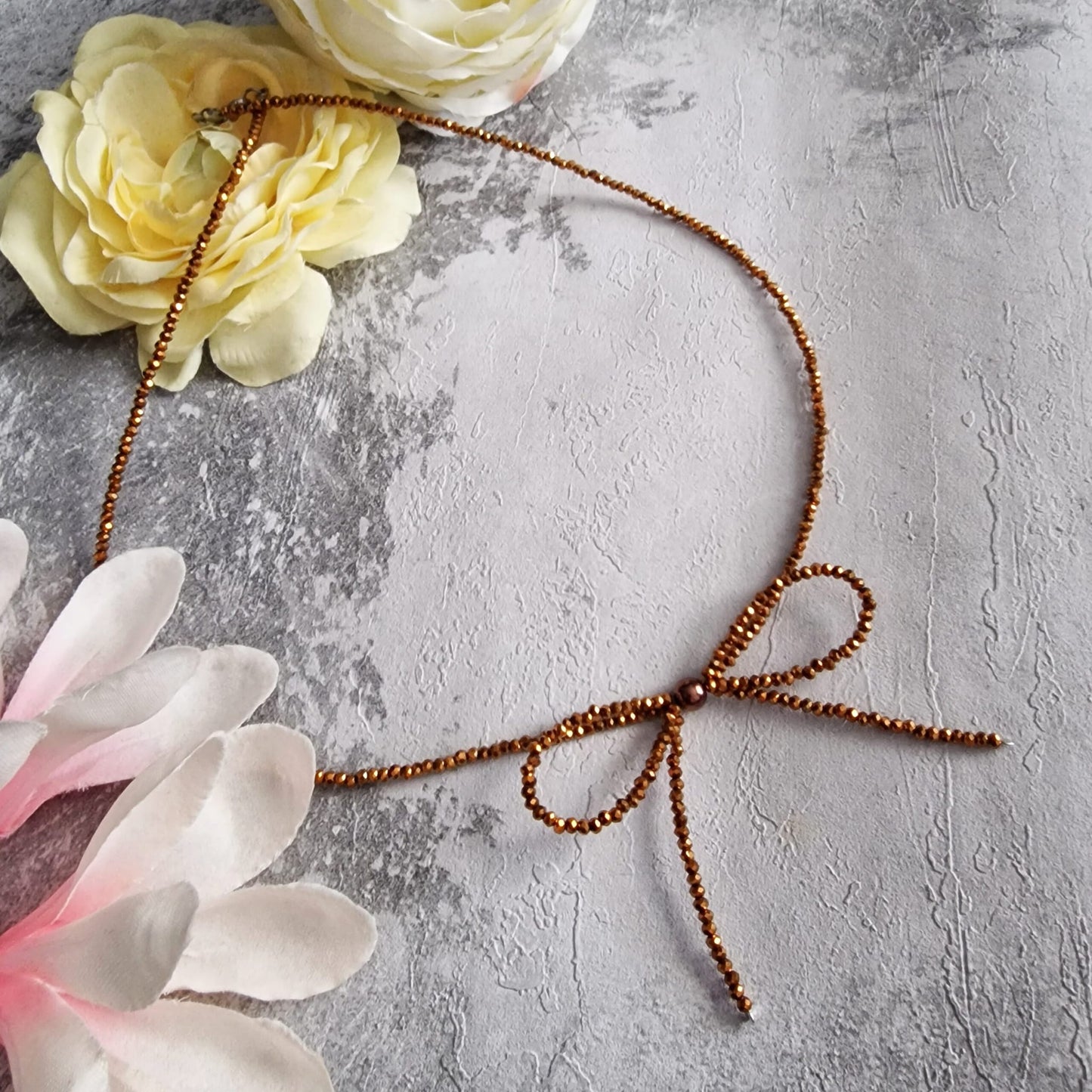 Luminous Gold Glass Crystals Bow Necklace