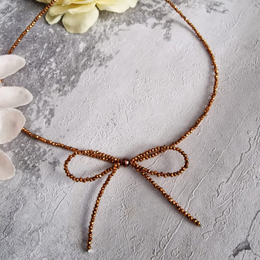 Luminous Gold Glass Crystals Bow Necklace