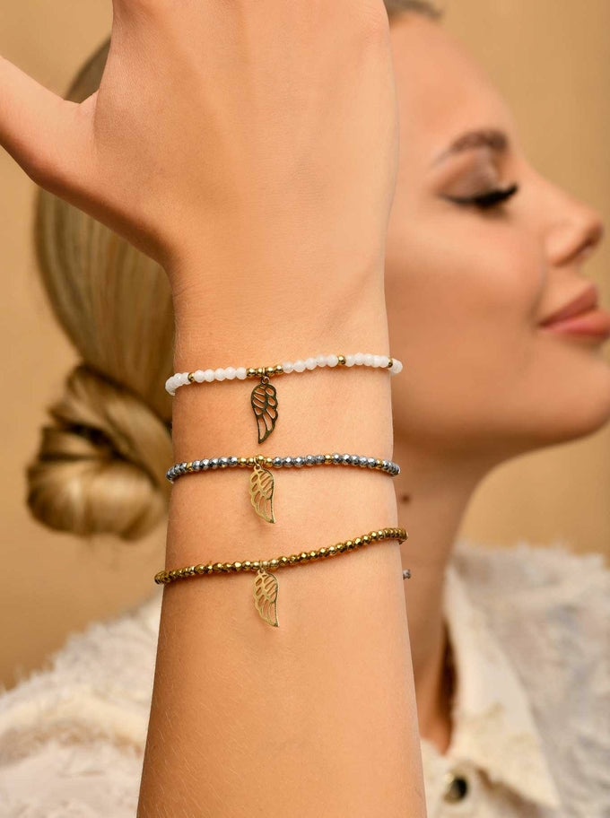 Adjustable White Beads Bracelet with Gold Plated Angel Wing